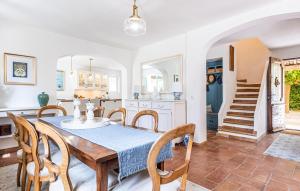 a kitchen and dining room with a table and chairs at Stunning Home In Callian With Wifi in Callian