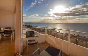 a balcony with a view of the ocean at 3 Bedroom Cozy Apartment In Santa Pola in Santa Pola