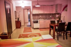 a kitchen and dining room with a table and a dining room at Erifili Kallithea in Kallithea Halkidikis