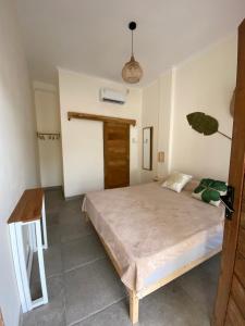 Ліжко або ліжка в номері Sastro Place