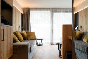 Posezení v ubytování DOLOMITI EXCLUSIVE YOUR MOUNTAIN SUITE