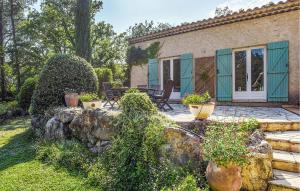 a house with a garden and a patio at Gorgeous Home In Callian With Wifi in Callian