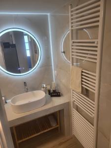 a bathroom with a sink and a mirror at Villa Elia Perigiali Lefkada in Nydri