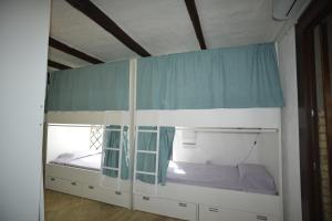 Letto o letti in una camera di Kite Hostel Stagnone