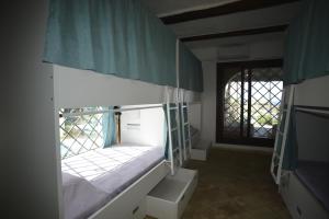 Letto o letti in una camera di Kite Hostel Stagnone