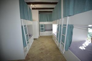 Letto o letti in una camera di Kite Hostel Stagnone