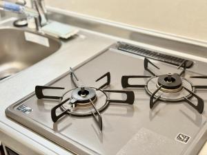 a stove top with two burners on top of it at LANG Hotel GINZA 1K in Tokyo +126 photos