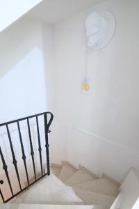 A bed or beds in a room at Villetta Panoramica con Giardino a Riccione