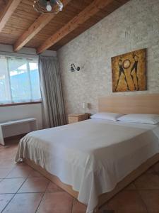 Ένα ή περισσότερα κρεβάτια σε δωμάτιο στο B&B Villa Luisa Apartment