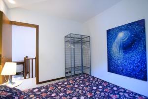 A bed or beds in a room at Villetta Panoramica con Giardino a Riccione