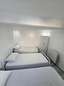 a small room with two beds in it at Taghazout Flats in Taghazout