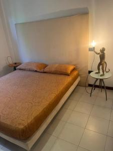 A bed or beds in a room at Villetta Panoramica con Giardino a Riccione