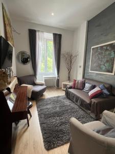a living room with a couch and a table at Correa Vatican Hospitality in Rome