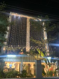 a building with lights on it at night at Hotel Nirvana Residency in Nagpur