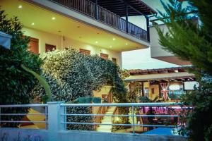 a building with a bunch of plants in front of it at Erifili Kallithea in Kallithea Halkidikis