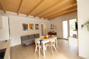 a living room with a table and a couch at La casa nel verde in Recanati +31 photos