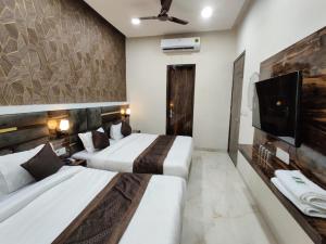 Voodi või voodid majutusasutuse Hotel GS Grand Amritsar toas