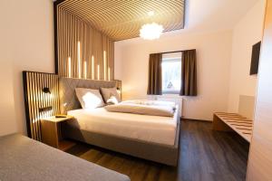 Letto o letti in una camera di Hotel Alpenblick
