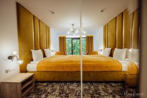 a bedroom with a large bed and a large window at Cristal in Ustka +101 photos