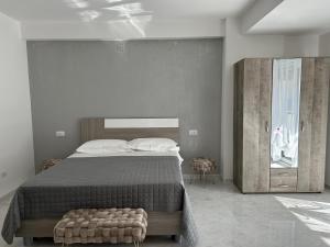 a bedroom with a large bed and a large window at Aqua Marine B&B - Rooms and Apartments in Milazzo +72 photos