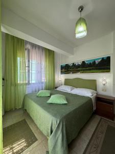 Llit o llits en una habitació de Hotel Kaduku