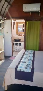 Postel nebo postele na pokoji v ubytování Zoé Bungalows