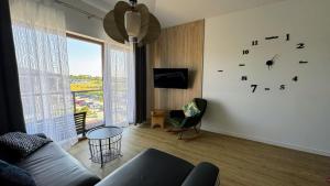 Μια τηλεόραση ή/και κέντρο ψυχαγωγίας στο Apartament BLUE37