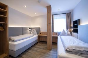 Letto o letti in una camera di Hotel Alpenblick