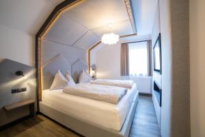 Letto o letti in una camera di Hotel Alpenblick