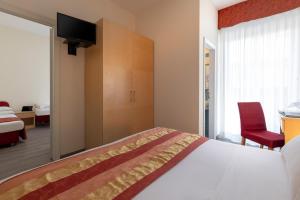 Postel nebo postele na pokoji v ubytování Hotel Cristina Corona