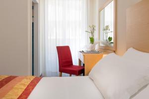 Postel nebo postele na pokoji v ubytování Hotel Cristina Corona
