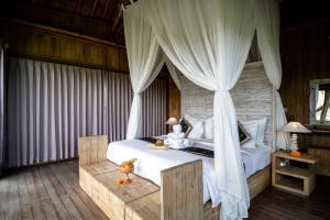 Postel nebo postele na pokoji v ubytování Padi Bali Retreat