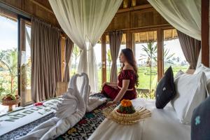 Postel nebo postele na pokoji v ubytování Padi Bali Retreat