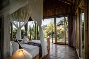 Postel nebo postele na pokoji v ubytování Padi Bali Retreat + 37 fotografií