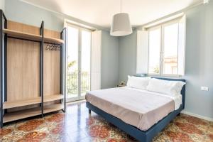 Postel nebo postele na pokoji v ubytování VILLA ACTEA