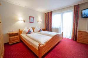 Letto o letti in una camera di Hotel Alpenblick