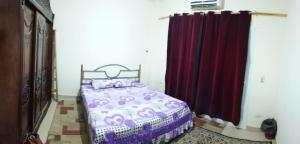Postel nebo postele na pokoji v ubytování Mousa coast Resort شالية كامل للايجار موسي كوست