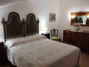 Postel nebo postele na pokoji v ubytování casa vacanze degli archi