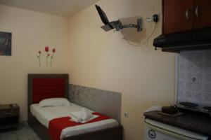 Posteľ alebo postele v izbe v ubytovaní House Stamatis