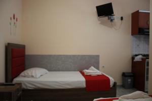 Posteľ alebo postele v izbe v ubytovaní House Stamatis