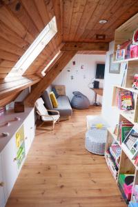 a living room with a couch and a table at maison familiale proche plage in Quiberville