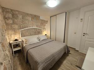 Postel nebo postele na pokoji v ubytování Apartman Muracca