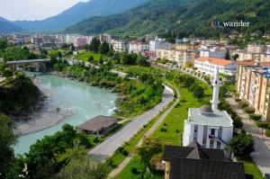 a view of a city with a river and buildings at Joan Guesthouse in Përmet