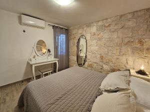 Posteľ alebo postele v izbe v ubytovaní Apartman Muracca