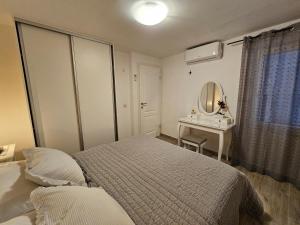 Postel nebo postele na pokoji v ubytování Apartman Muracca