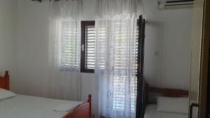 Postel nebo postele na pokoji v ubytování Guesthouse Sinani