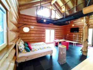 Posezení v ubytování Chalet Helen Deluxe Zimmer