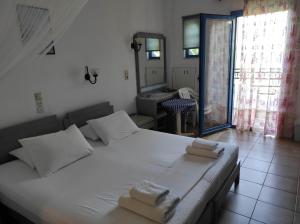 Posteľ alebo postele v izbe v ubytovaní Oasis Apartments