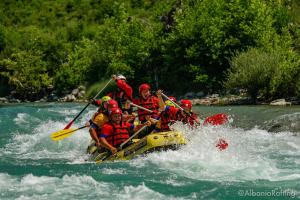 a group of people on a raft in a river at Joan Guesthouse in Përmet
