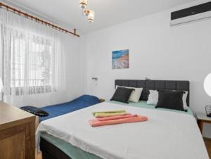 Postel nebo postele na pokoji v ubytování Apartman Arija-Pino